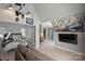 Spacious bedroom with a sitting area, cityscape view, and Carolina Panthers decor at 423 N Pine St, Charlotte, NC 28202