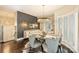 Stunning dining room with round table and chairs, complemented by modern lighting and a decorative wall at 423 N Pine St, Charlotte, NC 28202