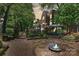 Charming brick home with beautifully landscaped garden and fountain at 423 N Pine St, Charlotte, NC 28202