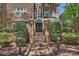 The home features an iron gate leading to the front entrance with a brick pathway at 423 N Pine St, Charlotte, NC 28202