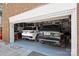 Two-car garage featuring white and black Range Rovers at 423 N Pine St, Charlotte, NC 28202