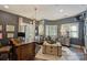 Spacious home office with plenty of natural light, hardwood floors, and stylish decor, ideal for a productive workspace at 423 N Pine St, Charlotte, NC 28202