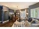 Sophisticated home office with hardwood floors, custom shelving, and stylish decor, perfect for productivity and comfort at 423 N Pine St, Charlotte, NC 28202