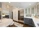 Kitchen with custom cabinets, stainless steel refrigerator, and breakfast nook at 423 N Pine St, Charlotte, NC 28202