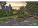 Scenic park view with walking paths, greenery, and city skyline at 423 N Pine St, Charlotte, NC 28202