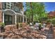 Inviting brick patio with outdoor seating and lush landscaping, perfect for relaxing or entertaining at 423 N Pine St, Charlotte, NC 28202