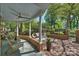 Inviting outdoor patio featuring brick paving, lounge area, and lush landscaping at 423 N Pine St, Charlotte, NC 28202