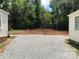 Gravel driveway and backyard space ready for landscaping at 424 Skyland Ave, Charlotte, NC 28205