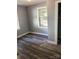Inviting bedroom with vinyl floors, neutral paint, bright windows for natural light, and a comfortable ambiance at 424 Skyland Ave, Charlotte, NC 28205