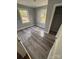 Cozy bedroom with durable laminate flooring, neutral walls, windows for ample natural light, and closet space at 424 Skyland Ave, Charlotte, NC 28205
