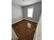 This cozy bedroom features hardwood floors and a bright window for natural light at 424 Skyland Ave, Charlotte, NC 28205