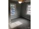 Sunlit bedroom featuring neutral-toned walls, plush carpet, and bright windows at 424 Skyland Ave, Charlotte, NC 28205