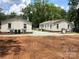 Exterior view of two homes with spacious yards and gravel driveways at 424 Skyland Ave, Charlotte, NC 28205