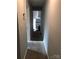 Hallway with carpeted floor leading to the kitchen at 424 Skyland Ave, Charlotte, NC 28205