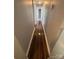 Hallway with gleaming hardwood floors leading to additional rooms at 424 Skyland Ave, Charlotte, NC 28205