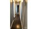 Long hallway with updated laminate flooring, neutral paint and white trim, ready for personal touches at 424 Skyland Ave, Charlotte, NC 28205