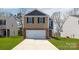 Charming new two-story home with attached two-car garage and well-manicured lawn at 506 13Th Avenue Ne Dr, Hickory, NC 28601