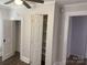 Bedroom with vinyl floors, closet, ceiling fan, and white walls with white trim at 507 Chrysler St, Kannapolis, NC 28083