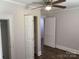 Bedroom with vinyl floors, closet, ceiling fan, and white walls with white trim at 507 Chrysler St, Kannapolis, NC 28083