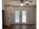 Bedroom with vinyl floors, closet, ceiling fan, and double doors to outside patio at 507 Chrysler St, Kannapolis, NC 28083