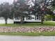 Charming single-story home with white siding, black shutters, and blooming crape myrtle trees at 507 Chrysler St, Kannapolis, NC 28083