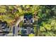 Aerial shot of a home and its lot in a wooded suburban area with a long, winding driveway at 5490 Sapwood Ct, Denver, NC 28037