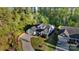 A beautiful home with a three-car garage, manicured front lawn, and a long driveway at 5490 Sapwood Ct, Denver, NC 28037