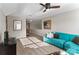 Bonus room showcasing a blue sofa, vaulted ceiling, and natural light streaming in from the windows at 5490 Sapwood Ct, Denver, NC 28037