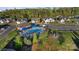 Community pool and play area with ample seating and umbrellas, perfect for neighborhood enjoyment at 5490 Sapwood Ct, Denver, NC 28037