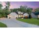 Charming home featuring a well-manicured lawn, two-car garage and a welcoming front porch at 5490 Sapwood Ct, Denver, NC 28037