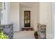Charming front porch with stone accents and a decorative wreath on the front door at 5490 Sapwood Ct, Denver, NC 28037