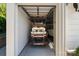 A golf cart parked inside a clean and organized single-car garage at 5490 Sapwood Ct, Denver, NC 28037