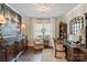 Sophisticated home office with rich wood furniture, natural light, and stylish decor at 5490 Sapwood Ct, Denver, NC 28037