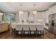 Spacious kitchen with white cabinetry, a large island, and modern stainless steel appliances at 5490 Sapwood Ct, Denver, NC 28037