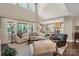 Bright and spacious living room with large windows and a clear view of the adjacent kitchen at 5490 Sapwood Ct, Denver, NC 28037