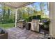 Backyard patio featuring outdoor grills and seating, providing the perfect space for entertaining outdoors at 5490 Sapwood Ct, Denver, NC 28037