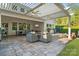 The outdoor patio features ceiling fans, outdoor tv, dining area, and an outdoor seating area with fire pit at 5490 Sapwood Ct, Denver, NC 28037