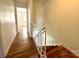 Hallway with wood-look floors leading to the bedrooms at 5812 Hunting Ridge Ln # A, Charlotte, NC 28212
