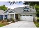 Charming craftsman home featuring stone accents, a two-car garage, and inviting curb appeal at 604 Banter Ln # 29, Cramerton, NC 28032