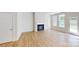Spacious living room featuring a cozy fireplace, hardwood flooring, and natural light at 604 Banter Ln # 29, Cramerton, NC 28032