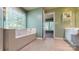 Bright bathroom featuring a soaking tub, walk-in shower, and dual sink vanity at 6100 Hunter Ln, Weddington, NC 28104
