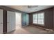 Large bedroom with a fan, light-filled window and ensuite bathroom at 6100 Hunter Ln, Weddington, NC 28104