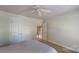 Light-filled bedroom with neutral carpet and fan, offering a comfortable retreat at 6100 Hunter Ln, Weddington, NC 28104