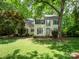 Charming two-story home with traditional architecture and lush front lawn surrounded by mature trees at 6100 Hunter Ln, Weddington, NC 28104