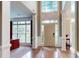 Bright foyer with hardwood floors, tall ceilings, and large windows creating an inviting entryway at 6100 Hunter Ln, Weddington, NC 28104