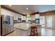 Well-lit kitchen features stainless steel appliances, white cabinets, and a large island at 6100 Hunter Ln, Weddington, NC 28104
