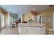 Open concept kitchen with large island, seamlessly connects to living and dining areas at 6100 Hunter Ln, Weddington, NC 28104