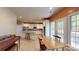 The kitchen offers white cabinets, stainless steel appliances, and a center island with barstool seating at 6100 Hunter Ln, Weddington, NC 28104