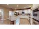 Inviting kitchen featuring white cabinets, stainless appliances, and a central island at 6100 Hunter Ln, Weddington, NC 28104