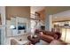 This living room has built-in shelves, natural light, and a leather couch surrounding a round coffee table at 6100 Hunter Ln, Weddington, NC 28104
